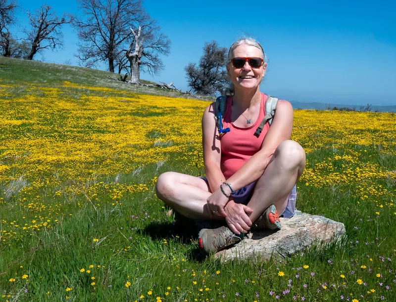 Sitting among spring wildflowers in the park
